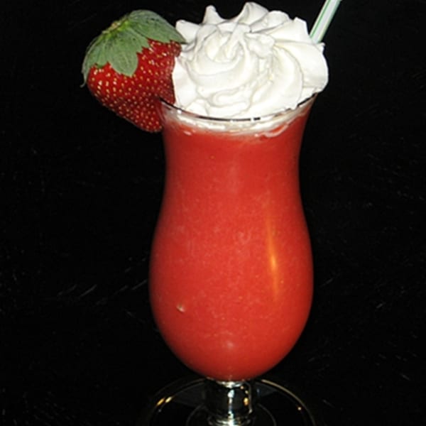 Strawberry daiquiri with whipped cream and a fresh strawberry garnish from El Nopal Mexican Restaurant.